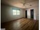 Bedroom with hardwood floors and bright natural light, offering ample space and storage at 1041 Sandy Ridge Rd, Mcdonough, GA 30252