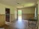 Bright dining area with laminate flooring, wood paneling and views to the back deck at 1041 Sandy Ridge Rd, Mcdonough, GA 30252