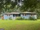 Charming single-story home featuring a welcoming front porch and well-kept landscaping at 1041 Sandy Ridge Rd, Mcdonough, GA 30252