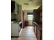 Functional kitchen featuring essential appliances and wood cabinets at 1041 Sandy Ridge Rd, Mcdonough, GA 30252