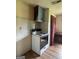 Kitchen features an electric range and view into the next room at 1041 Sandy Ridge Rd, Mcdonough, GA 30252