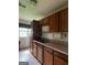 Kitchen with wooden cabinets, laminate countertops, and a sink near the window at 1041 Sandy Ridge Rd, Mcdonough, GA 30252