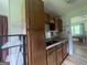 Functional kitchen area featuring wood cabinets and a view to the next room at 1041 Sandy Ridge Rd, Mcdonough, GA 30252
