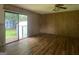 Hardwood flooring and sliding doors in a living room space at 1041 Sandy Ridge Rd, Mcdonough, GA 30252