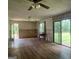 Comfortable living room with wood flooring and natural light from the sliding glass door at 1041 Sandy Ridge Rd, Mcdonough, GA 30252