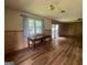 Spacious living area with hardwood flooring, natural light, and a sliding door at 1041 Sandy Ridge Rd, Mcdonough, GA 30252