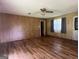 Open-concept living space featuring hardwood floors and classic wood paneling at 1041 Sandy Ridge Rd, Mcdonough, GA 30252