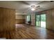 Spacious living room featuring wood flooring and a sliding glass door to the exterior at 1041 Sandy Ridge Rd, Mcdonough, GA 30252
