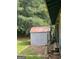 Shed in the backyard with a weathered roof and siding at 1041 Sandy Ridge Rd, Mcdonough, GA 30252