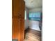 Storage area featuring wood cabinetry and a window for natural light at 1041 Sandy Ridge Rd, Mcdonough, GA 30252