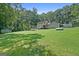 Expansive backyard with lush greenery and mature trees, offering privacy at 292 Selfridge Rd, Mcdonough, GA 30252
