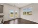 Sun-filled dining area features hardwood floors, neutral paint, and backyard access at 12071 Conrad Cir, Hampton, GA 30228