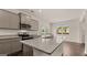 Modern kitchen featuring granite countertops, stainless steel appliances, and ample cabinet space at 12071 Conrad Cir, Hampton, GA 30228