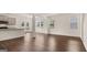 Spacious and airy living room features an open layout, hardwood floors, and plenty of natural light at 12071 Conrad Cir, Hampton, GA 30228