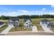 Street view showcases three stunning homes with manicured lawns at 12071 Conrad Cir, Hampton, GA 30228