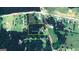Aerial view of a property at 403 Chester Piper Rd, surrounded by lush greenery, trees and nearby roads at 403 Chester Piper Rd, Covington, GA 30014