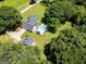 Expansive property featuring a pool, outbuilding, lush trees, and well-maintained landscaping at 403 Chester Piper Rd, Covington, GA 30014