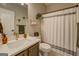 Well-lit bathroom featuring a modern vanity, decorative shelves, and a clean, neutral color scheme at 403 Chester Piper Rd, Covington, GA 30014