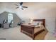 Spacious bedroom featuring a large bed, vaulted ceiling, and a cozy area for a home office at 403 Chester Piper Rd, Covington, GA 30014