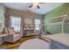 A delightful bedroom with playful decor, a charming bed frame, and an abundance of natural light at 403 Chester Piper Rd, Covington, GA 30014