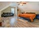 Upstairs bedroom with a comfortable seating area and an adjacent bedroom suite at 403 Chester Piper Rd, Covington, GA 30014