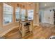 Charming breakfast nook with a farmhouse-style table set, lots of natural light, and views of the outdoor pool at 403 Chester Piper Rd, Covington, GA 30014