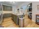 Open kitchen layout with a center island and seamless flow into the living room at 403 Chester Piper Rd, Covington, GA 30014