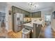 Spacious kitchen features stainless steel appliances, a center island, and ample counter space at 403 Chester Piper Rd, Covington, GA 30014