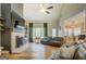 Bright living room featuring a fireplace, vaulted ceilings, and large windows at 403 Chester Piper Rd, Covington, GA 30014