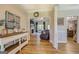 Open-concept living space with views to the fireplace, kitchen, and dining areas at 403 Chester Piper Rd, Covington, GA 30014