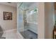 Modern primary bathroom boasts a glass shower, sleek fixtures, and contemporary design for a spa-like experience at 403 Chester Piper Rd, Covington, GA 30014