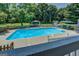 Backyard pool area featuring lush landscaping and a covered gazebo at 403 Chester Piper Rd, Covington, GA 30014