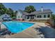 Large pool with seating area, privacy fence, and covered patio at 403 Chester Piper Rd, Covington, GA 30014