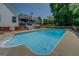 Inviting backyard pool with concrete surround and privacy fence at 403 Chester Piper Rd, Covington, GA 30014