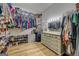 Well-organized walk-in closet with custom shelving, hanging rods, and a vanity mirror to maximize space and functionality at 403 Chester Piper Rd, Covington, GA 30014
