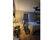 Bedroom with light colored walls, a ceiling fan, TV, and ample natural light from a window at 8778 Homewood Ct, Riverdale, GA 30274