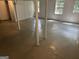 Unfinished basement featuring painted walls and floors, natural light, and support columns, offering a blank canvas at 2202 Springdale Dr, Snellville, GA 30078