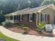 Side view of brick house showing walkway and side entrance at 2202 Springdale Dr, Snellville, GA 30078
