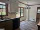 Bright kitchen with stylish countertops, modern appliances, and adjacent dining space with ample natural light at 2202 Springdale Dr, Snellville, GA 30078