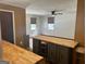 Bright kitchen and dining area featuring a butcher block island with updated cabinets, great for entertaining at 2202 Springdale Dr, Snellville, GA 30078