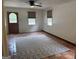 Cozy living room with a ceiling fan, tile flooring, and natural light, offers a comfortable living space at 2202 Springdale Dr, Snellville, GA 30078