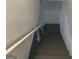 Basement stairway with white walls and railing at 2202 Springdale Dr, Snellville, GA 30078