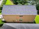 Aerial view of roof with solar panels, back yard, and residential neighborhood at 9132 Overlook Dr, Jonesboro, GA 30238