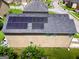 Aerial view of roof featuring installed solar panels in a residential neighborhood at 9132 Overlook Dr, Jonesboro, GA 30238