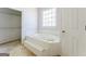 Bathroom featuring a tub, a window, and a walk-in closet at 145 Windy Ridge Ct, Fayetteville, GA 30214