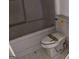 Bathroom showcasing a soaking tub with a toilet at 145 Windy Ridge Ct, Fayetteville, GA 30214