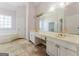 Bathroom featuring a large mirror, a sink, and a tub at 145 Windy Ridge Ct, Fayetteville, GA 30214