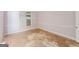 Standard bedroom featuring a window and baseboard trim; ready for renovation at 145 Windy Ridge Ct, Fayetteville, GA 30214
