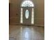 Bright entryway featuring a decorative front door and tile floors at 145 Windy Ridge Ct, Fayetteville, GA 30214