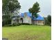 Sprawling two-story home with a covered roof on a large front yard at 145 Windy Ridge Ct, Fayetteville, GA 30214
